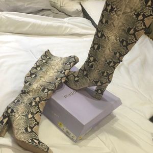 Snakeskin tall boots